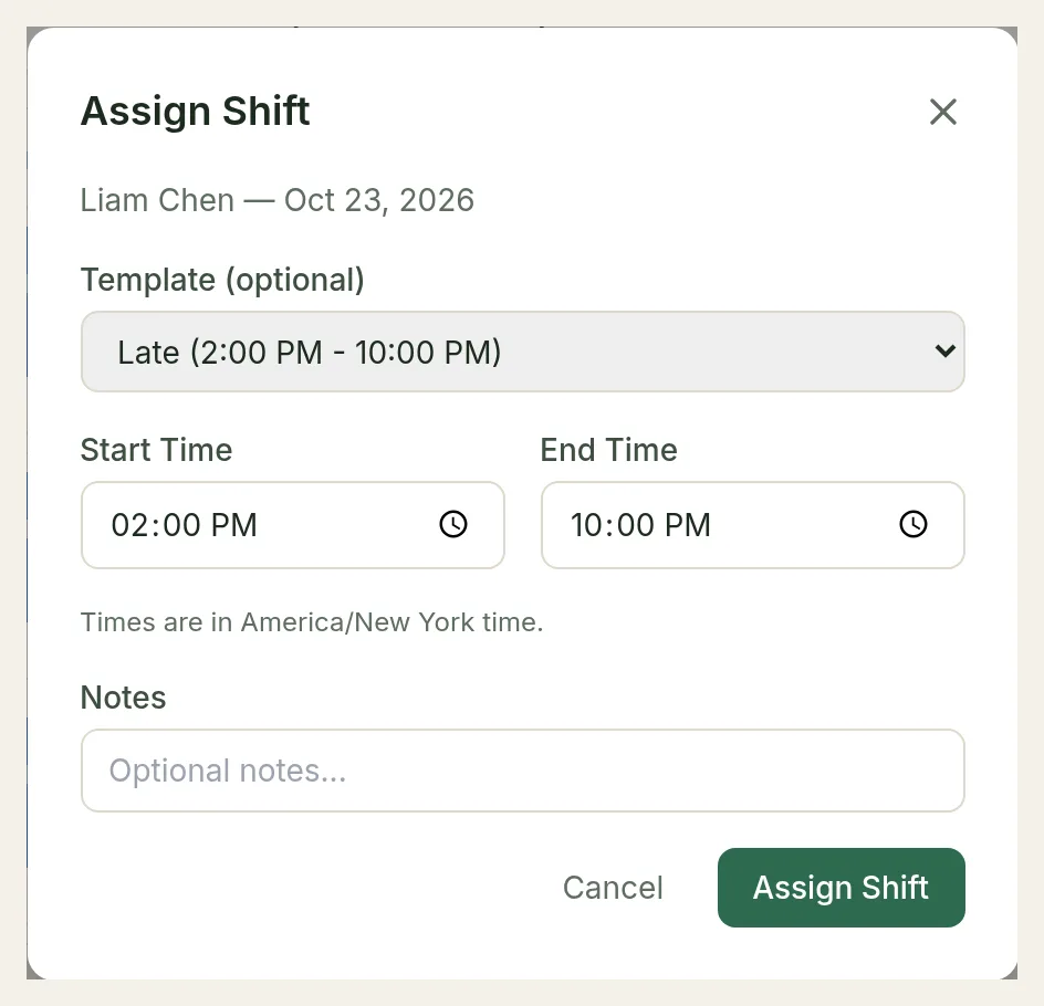 The Assign Shift dialog for Liam Chen on Oct 23, 2026 with the Late template from 2:00 PM to 10:00 PM and the note "Times are in America/New York time."